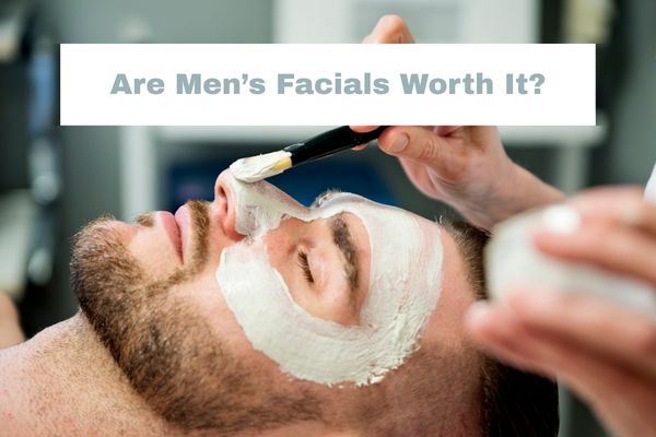 Men receiving a professional facial treatment at The Players Lounge Edinburgh, with a skincare mask applied using a brush